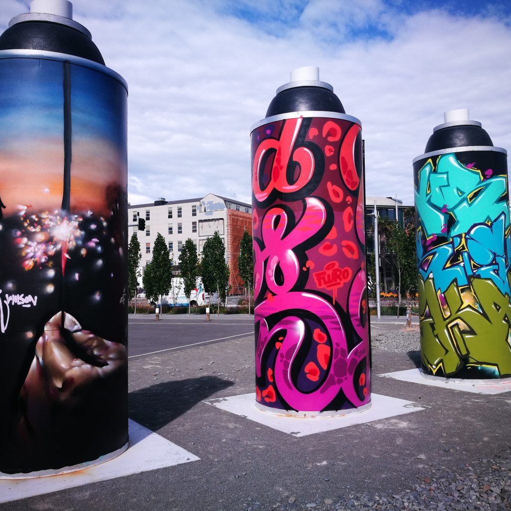 The Giant Cans got a make-over with new work by (L-R) Wongi 'Freak' Wilson, Fluro (Holly Ross) and Ikarus.