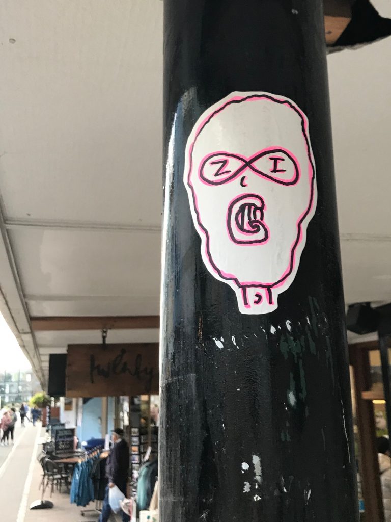 A hand drawn sticker by ZIG, featuring a ski mask wearing character.