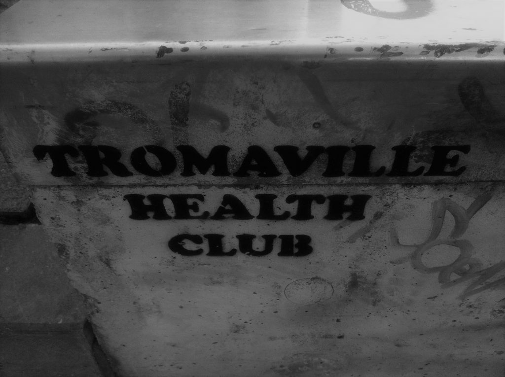 The words Tromaville Health Club, a reference to the trashy 1980s Troma films, is stencilled on a wall