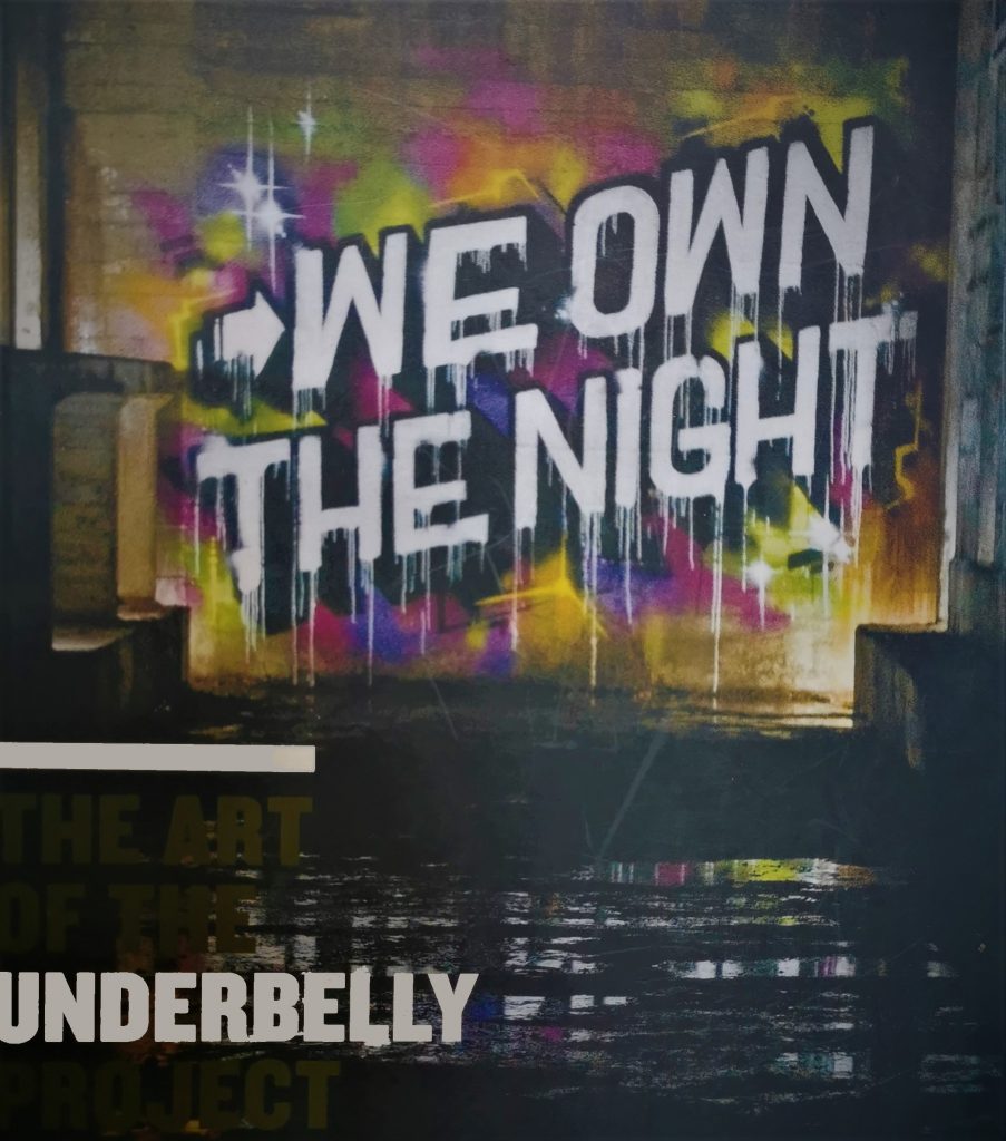 The cover of the book We Own the Night, featuring an aerosol painting of the title as par tof the Underbelly Project