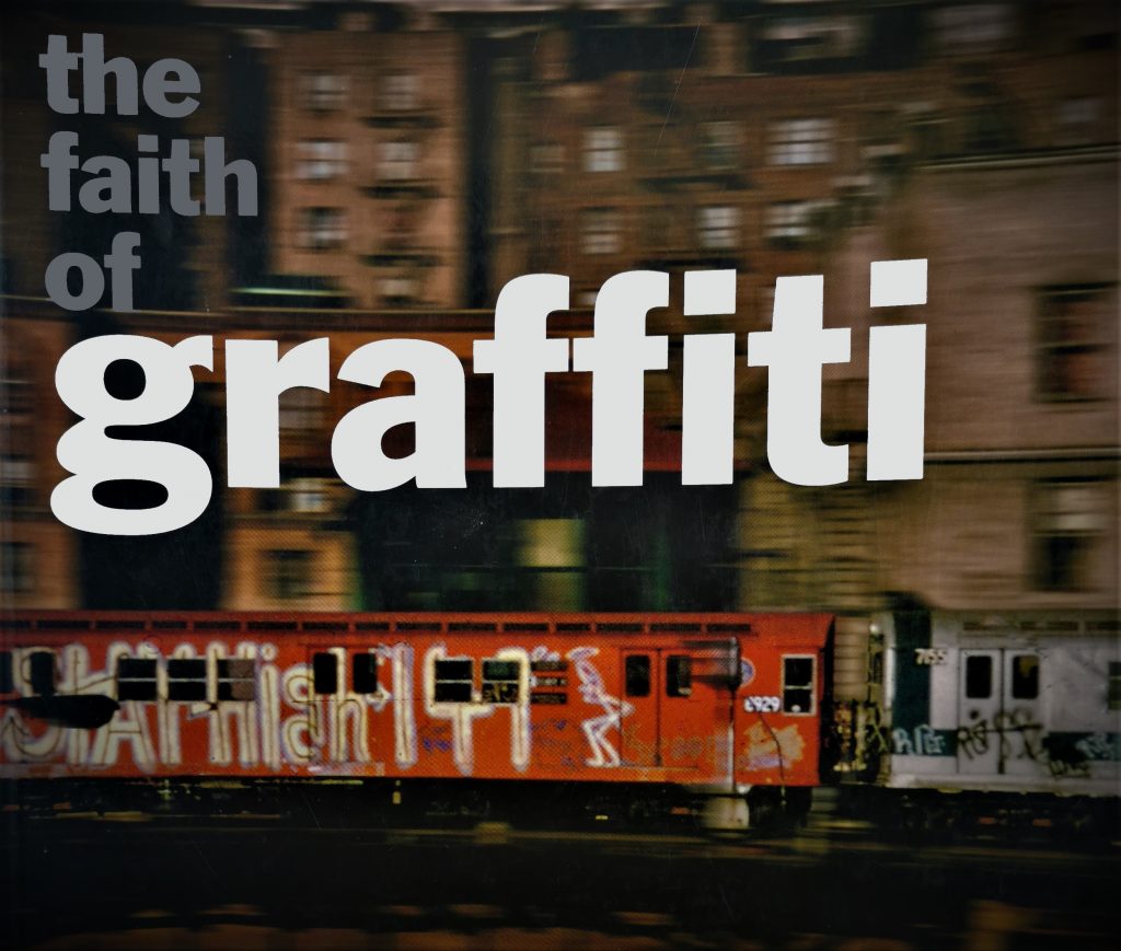 The cover of The Faith of Graffiti, featuring a graffiti-ed train in New York