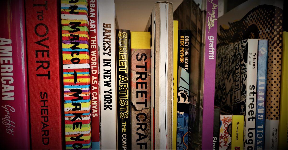 A row of urban art books in a bookshelf