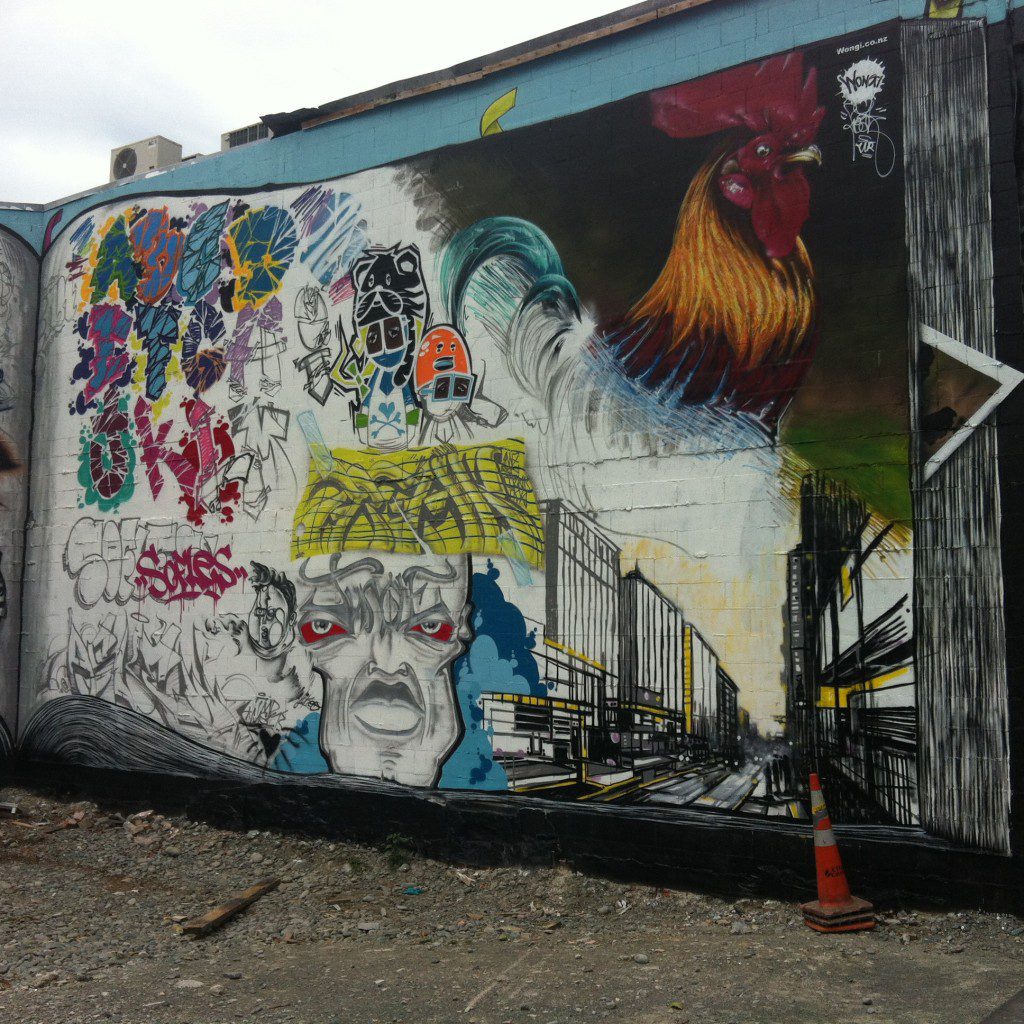 The 'Black Book' production co-ordinated by Ikarus and Freak for Rise in 2013. Located on the corner of Colombo and Hereford Streets, the wall featured the work of a number of artists, including Jungle's character and piece at the bottom centre.